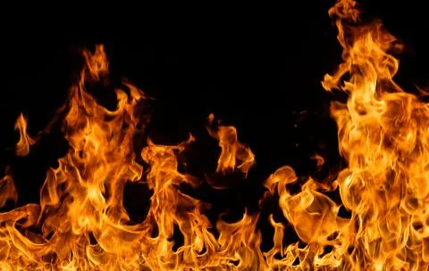 Fire flames on black background. Stock Photos