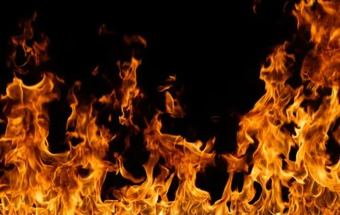 Fire flames on black background. Stock Photos