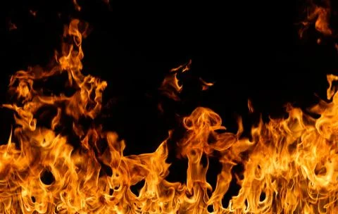 Fire flames on black background. Stock Photos