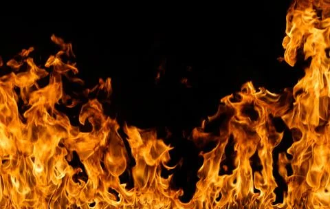 Fire flames on black background. Stock Photos