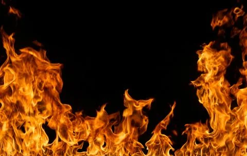 Fire flames on black background. Stock Photos