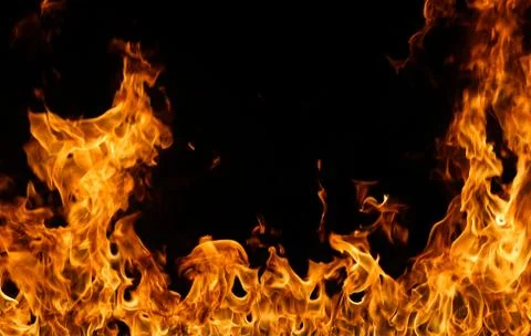 Fire flames on black background. Stock Photos