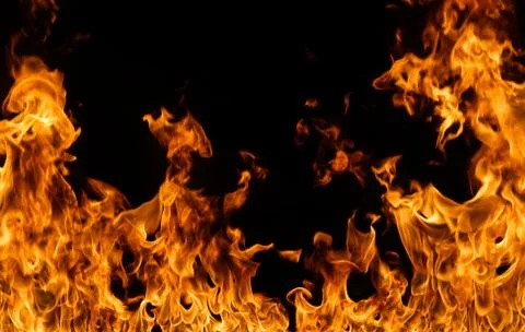 Fire flames on black background. Stock Photos