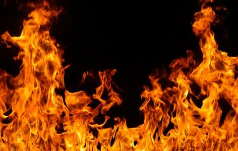 Fire flames on black background. Stock Photos