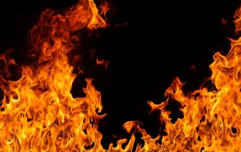 Fire flames on black background. Stock Photos