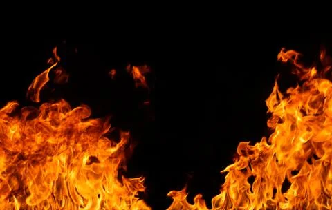 Fire flames on black background. Stock Photos