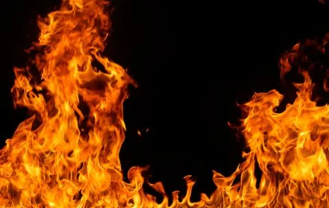 Fire flames on black background. Stock Photos