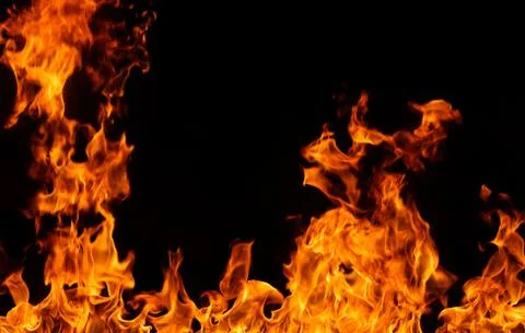 Fire flames on black background. Stock Photos