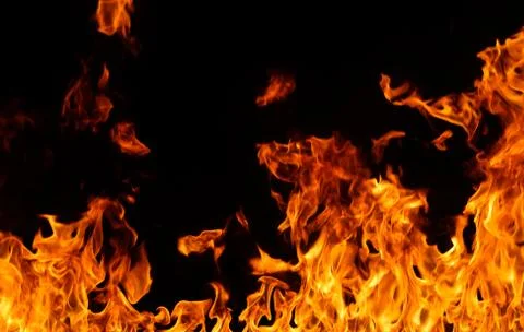 Fire flames on black background. Stock Photos