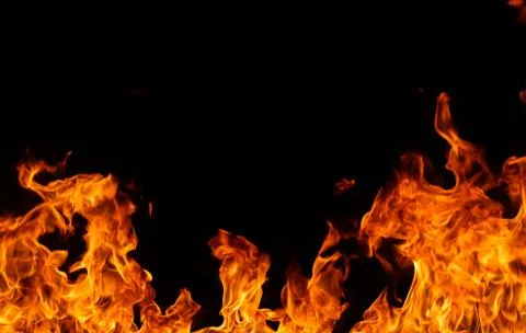 Fire flames on black background. Stock Photos