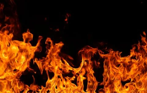 Fire flames on black background. Stock Photos