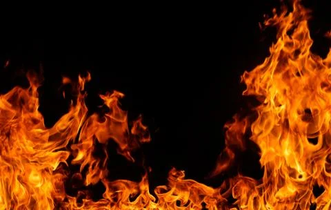 Fire flames on black background. Stock Photos