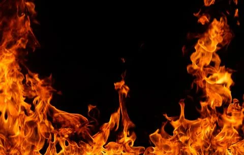Fire flames on black background. Stock Photos