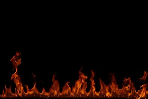 Fire flames on black background. Stock Photos