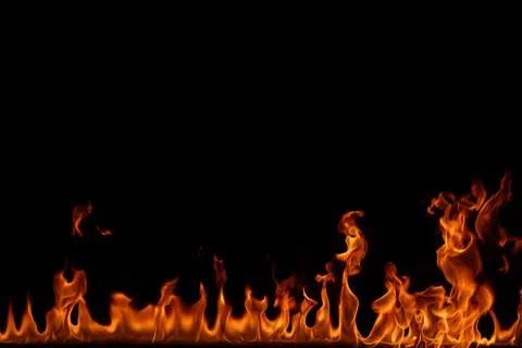 Fire flames on black background. Stock Photos