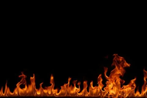 Fire flames on black background. Stock Photos