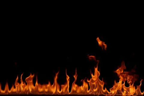 Fire flames on black background. Stock Photos