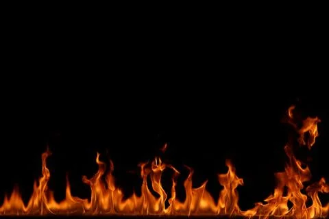 Fire flames on black background. Stock Photos