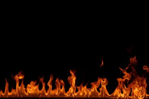Fire flames on black background. Stock Photos