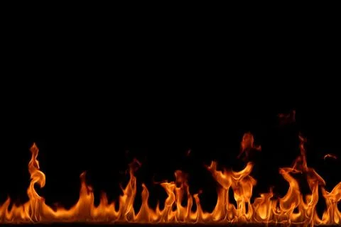 Fire flames on black background. Stock Photos