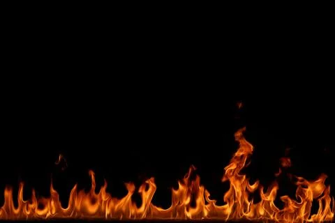 Fire flames on black background. Stock Photos