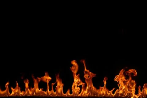 Fire flames on black background. Stock Photos