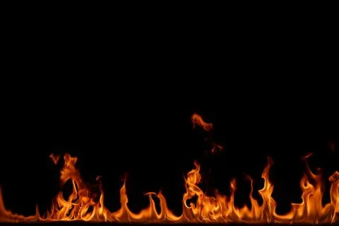 Fire flames on black background. Stock Photos