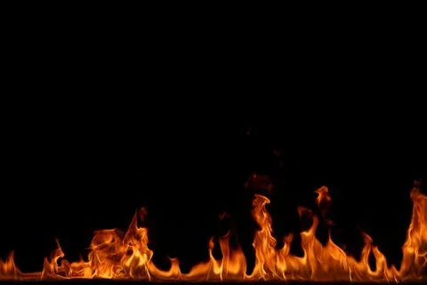 Fire flames on black background. Stock Photos