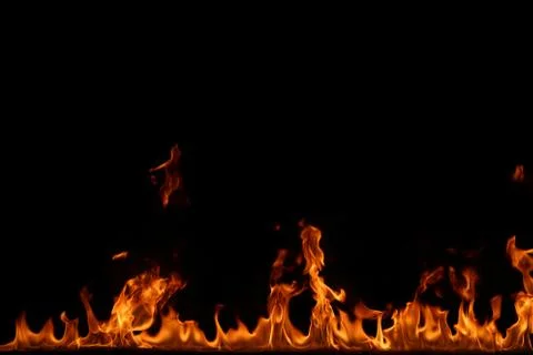 Fire flames on black background. Stock Photos