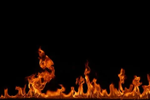 Fire flames on black background. Stock Photos
