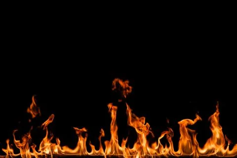 Fire flames on black background. Stock Photos