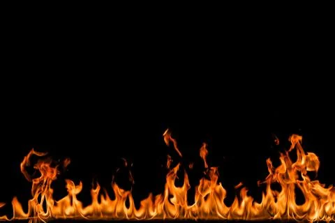 Fire flames on black background. Stock Photos