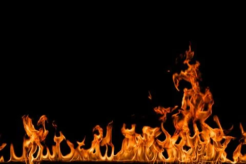 Fire flames on black background. Stock Photos