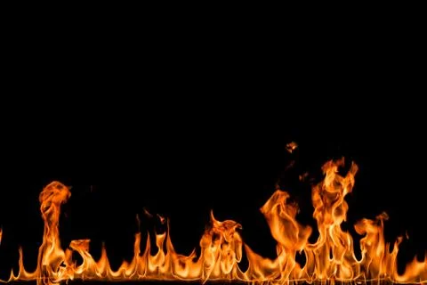 Fire flames on black background. Stock Photos