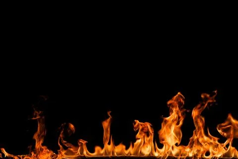 Fire flames on black background. Stock Photos
