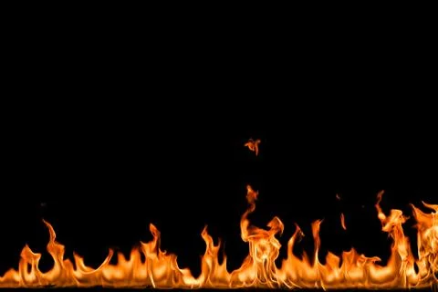 Fire flames on black background. Stock Photos