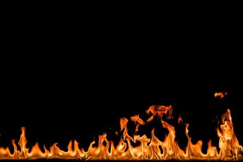 Fire flames on black background. Stock Photos