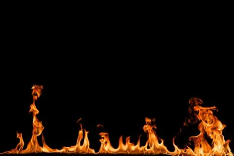 Fire flames on black background. Stock Photos