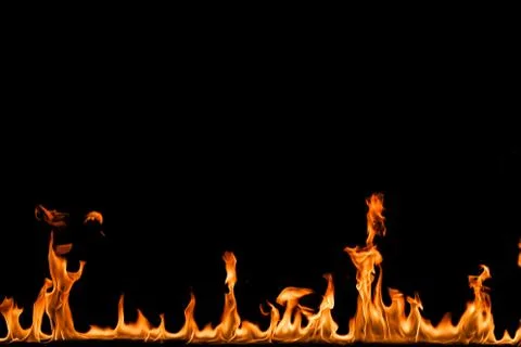 Fire flames on black background. Stock Photos
