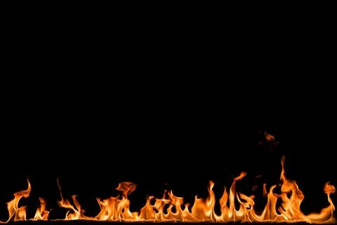Fire flames on black background. Stock Photos