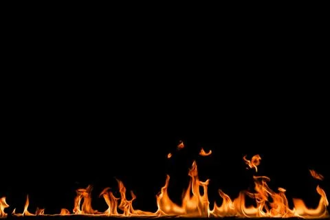 Fire flames on black background. Stock Photos