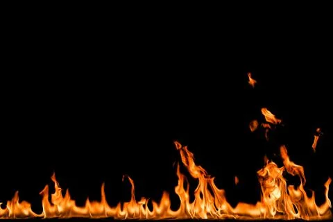 Fire flames on black background. Stock Photos