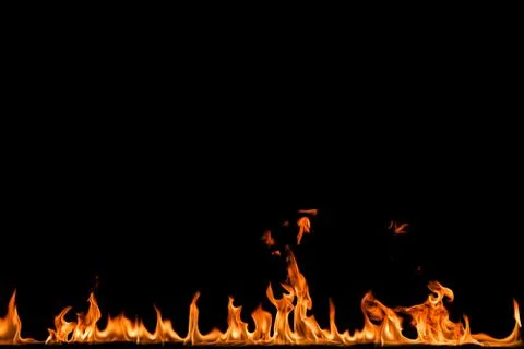 Fire flames on black background. Stock Photos