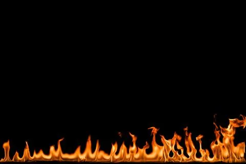 Fire flames on black background. Stock Photos