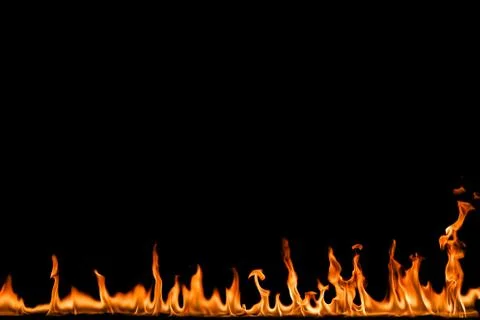 Fire flames on black background. Stock Photos