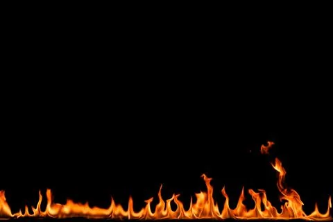 Fire flames on black background. Stock Photos