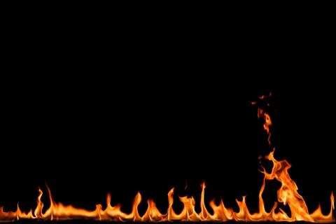 Fire flames on black background. Stock Photos