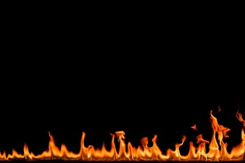 Fire flames on black background. Stock Photos