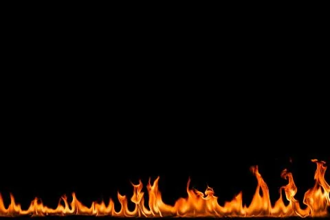 Fire flames on black background. Stock Photos