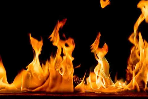 Fire flames on black background. Stock Photos
